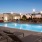 a swimming pool with chairs around it