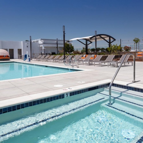 Settle into comfort at The Edge a swimming pool with a slide