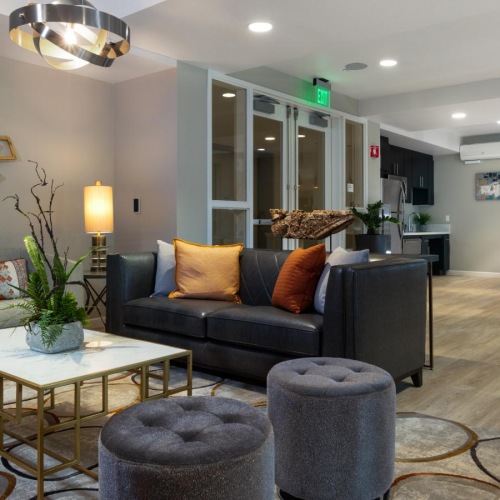 Settle into comfort at The Edge a living room with a couch and a coffee table