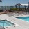 a pool with chairs around it