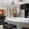 a kitchen with black chairs